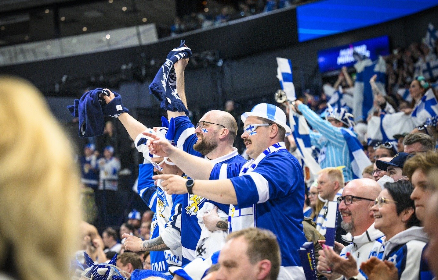 Finnish hockey fans cheering at a game